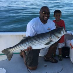 father and son striper fishing